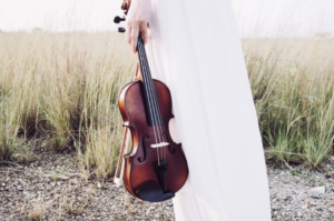 holding a violin